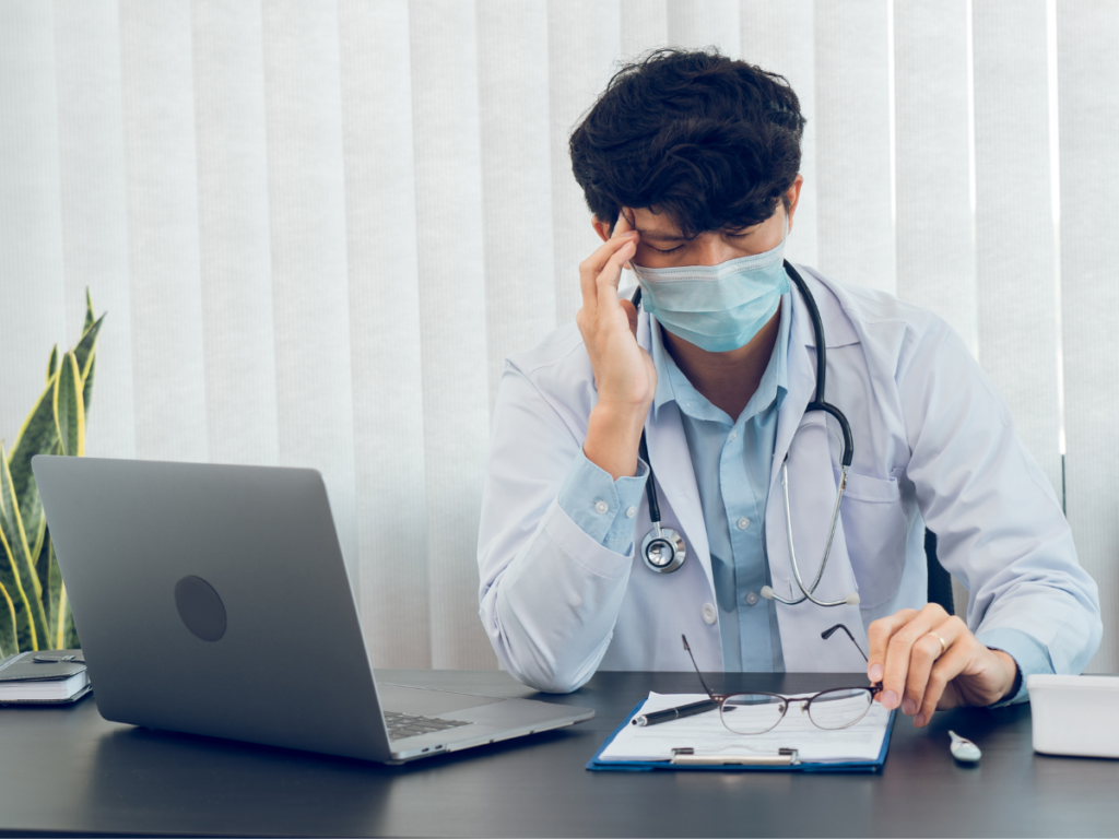 Physician burnout on laptop