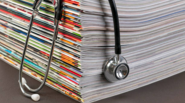 Stethoscope on a stack of magazines